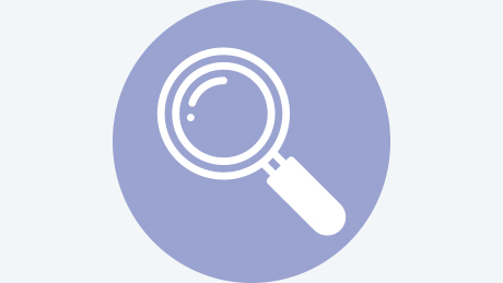 Icon of a magnifying glass.