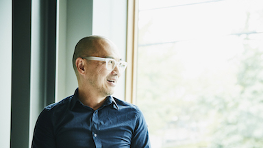 asian man looking outside