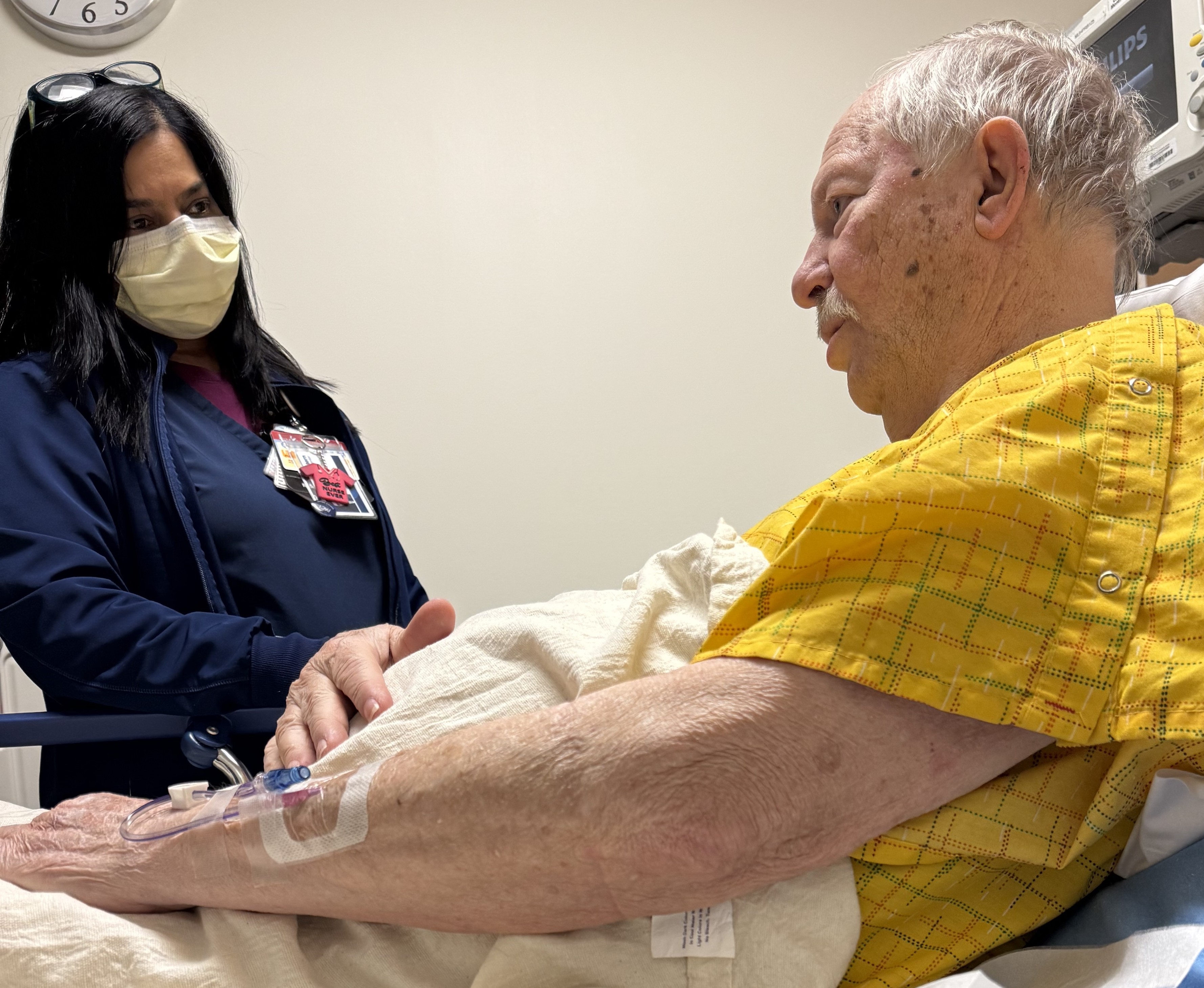 Patient Dan Dudley with a member of his care team at UT Southwestern