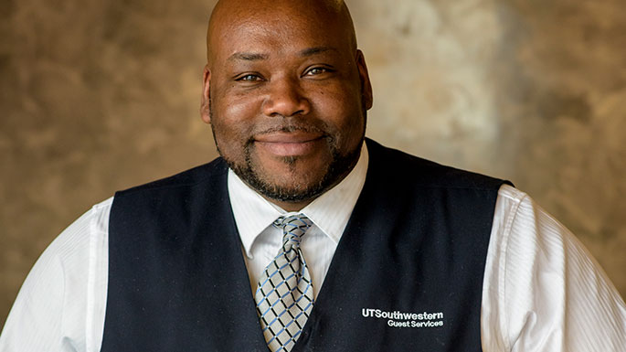 Male guest services representative at UT Southwestern