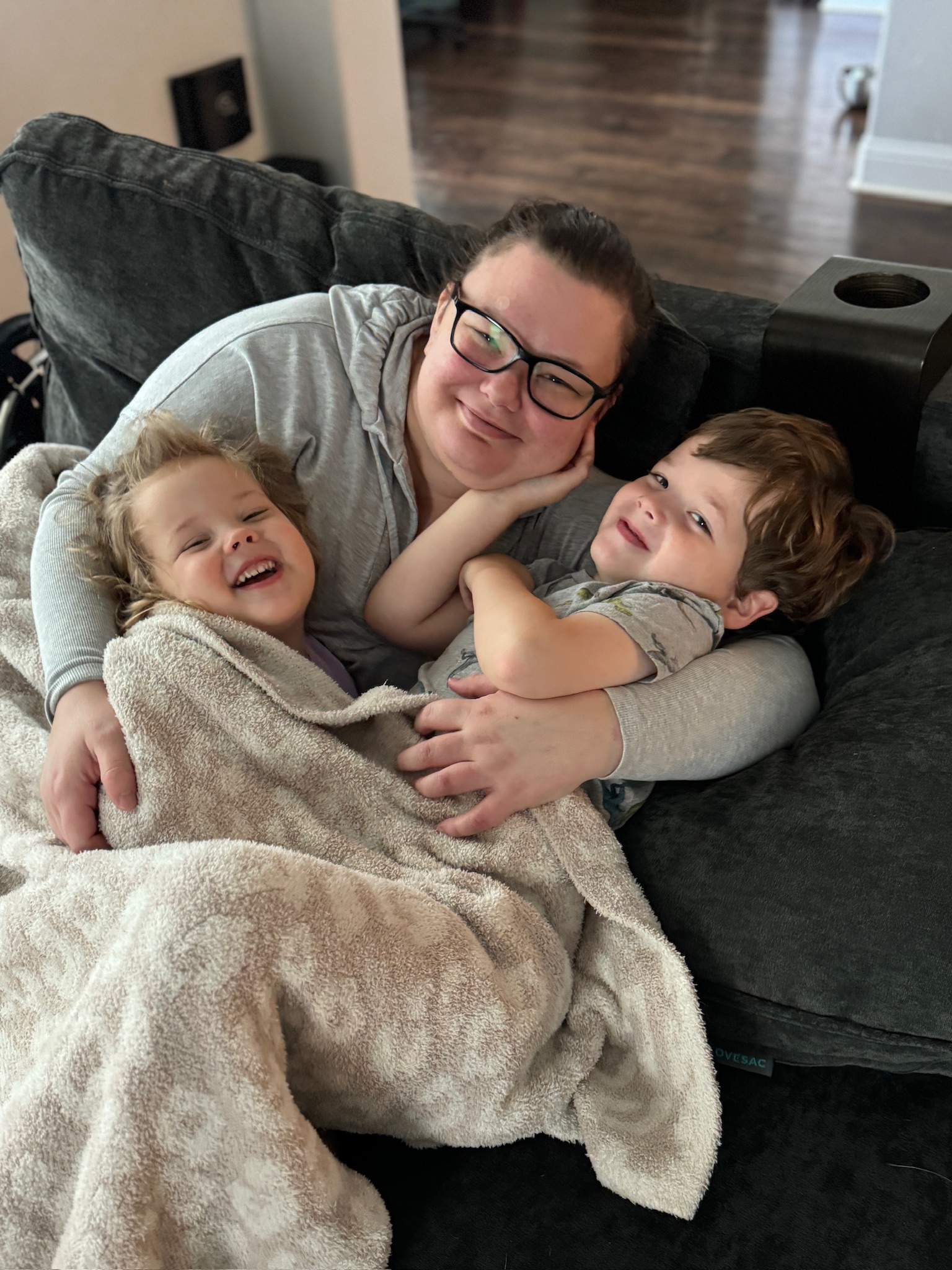 Owen with his mother Jacki and sister Evelyn at home