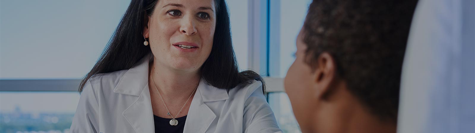 Dr. consulting with a patient