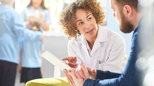 Pharmacist consulting with patient