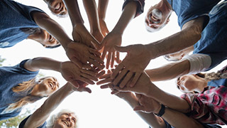 hands coming together in a cirlce