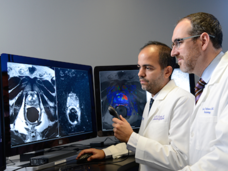 Doctors reviewing and discussing patient scans