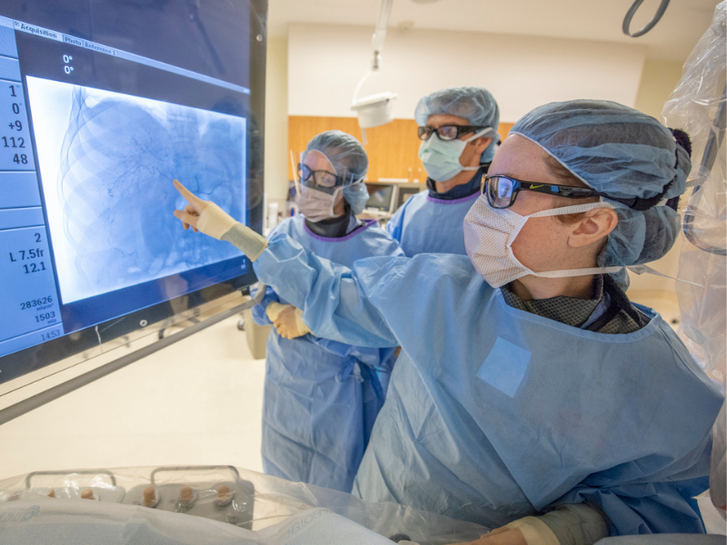 Clinic staff reviewing scans